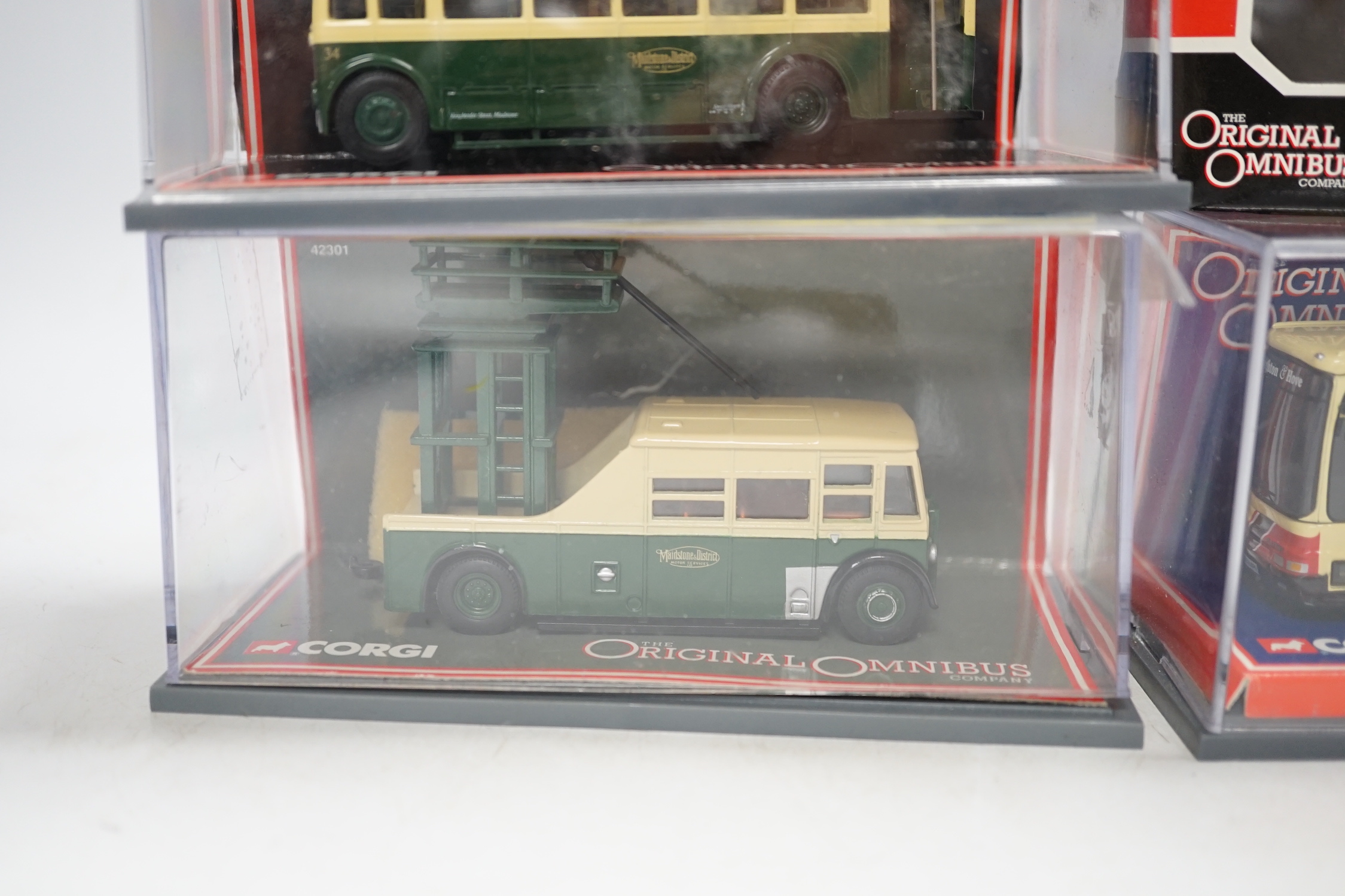 Thirty boxed 1:76 scale buses and coaches by Corgi OOC, Creative Master and Britbus, operators include Brighton & Hove, London Transport, Maidstone & District, East Kent, etc.